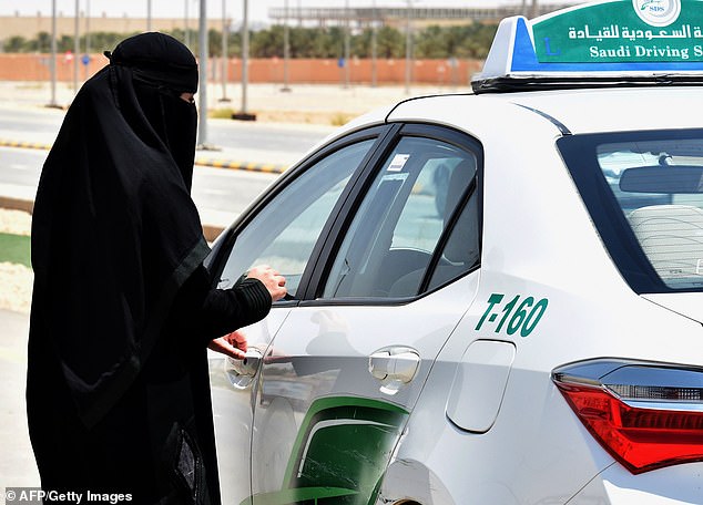 A Saudi woman prepares to start a driving lesson. Vision 2030 was launched by MBS in 2016 as part of an effort to diversify the petrostate's economy and create a 