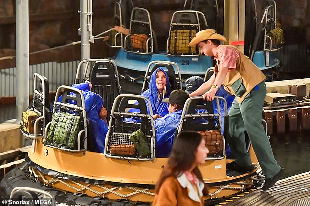 The family wore waterproof hooded jackets and let their hair down during the ride, which is based on the treacherous Kali River Rapids of Disney's Animal Kingdom