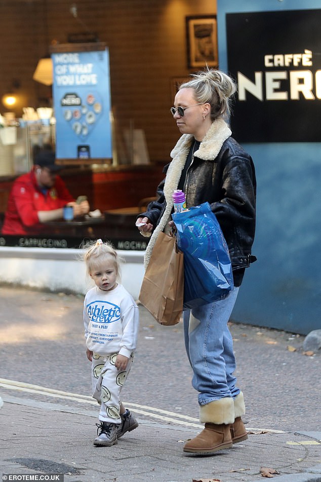 Chloe, who shares Bodhi with estranged husband James Haskell, 39, wrapped in a shearling flight jacket