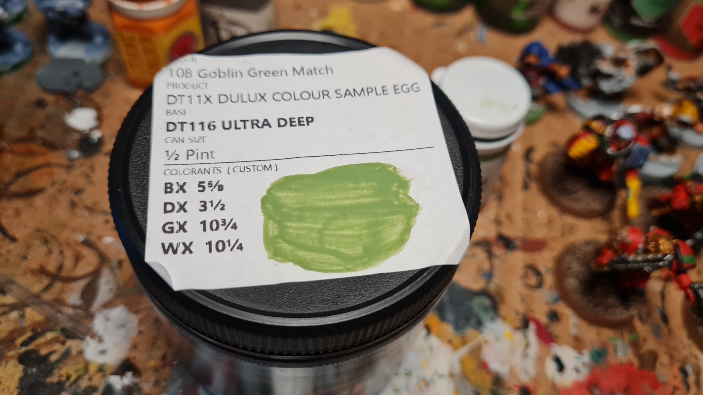 An overview of the colors used by Levis to match the color of Coat d'Arms Goblin Green. List from top to bottom: black BX, green DX, yellow DX, and white WX pigments used.