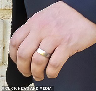 The couple was spotted wearing matching gold bands on their ring fingers during filming