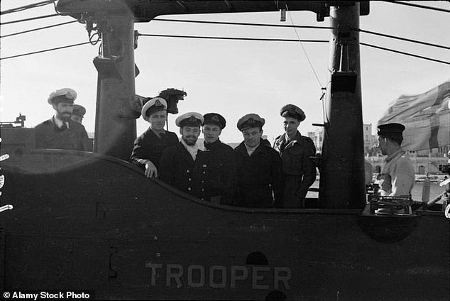 Submarines aboard HMS Trooper in a photo dated 4 February 1943