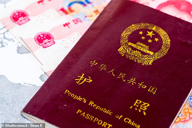 A Chinese passport. The number of public sector workers facing restrictions on their ability to travel abroad has expanded dramatically this year and includes most staff from schools, universities, local governments and other state-owned enterprises (stock image)