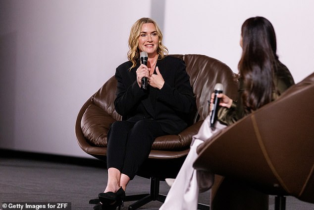 The Titanic star looked stunning in the black blazer and trousers which she teamed with a matching blouse and sky-high heels