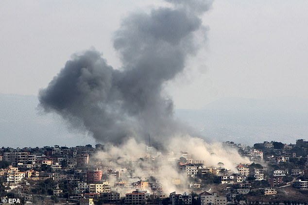 Smoke rises after an Israeli airstrike in the village of Khiam, seen from Marjaayoun, close to the border with Israel, in southern Lebanon