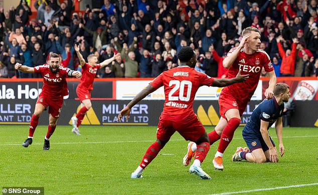 Ante Palaversa's late winner against Hearts kept the Dons alongside Celtic at the top