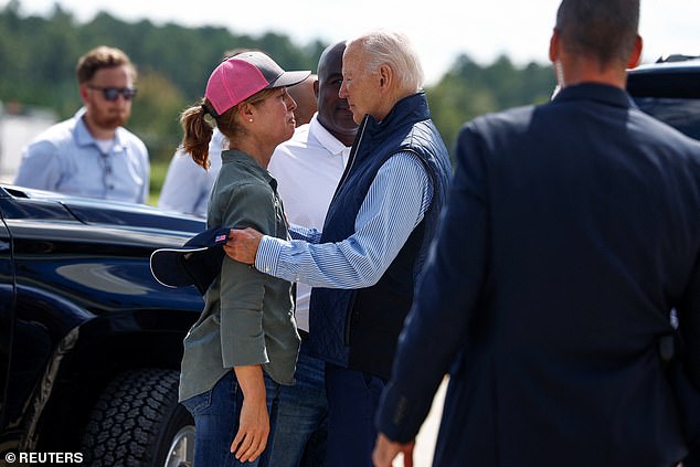 US President Joe Biden hugs Esther Manheimer, mayor of Asheville, North Carolina, during a visit on Tuesday