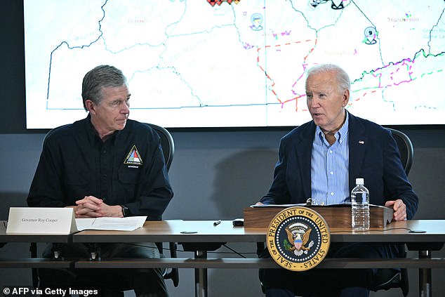 North Carolina Governor Roy Cooper (L) listens as US President Joe Biden speaks during an operational briefing at the Raleigh Emergency Operations Center following the passage of Hurricane Helene, in Raleigh, North Carolina, on October 2, 2024