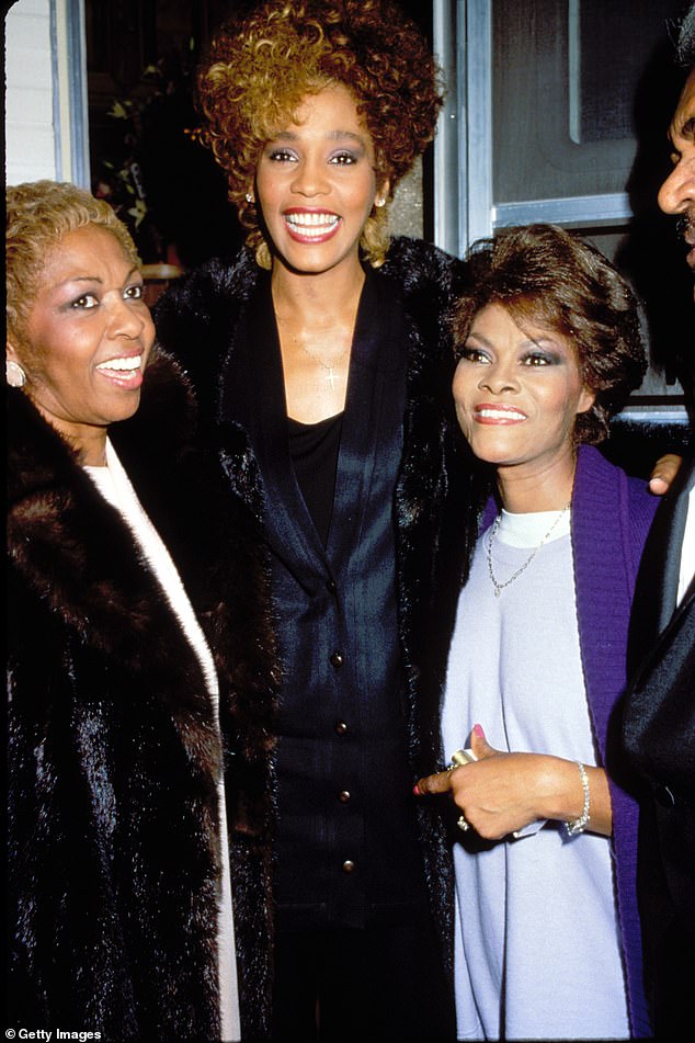 A source has since told People how her loved ones have been left reeling from her death: “The family is going through a tough time. They are getting through it, but it is very difficult now.” Seen with Whitney Houston and Dionne Warwick in 1987