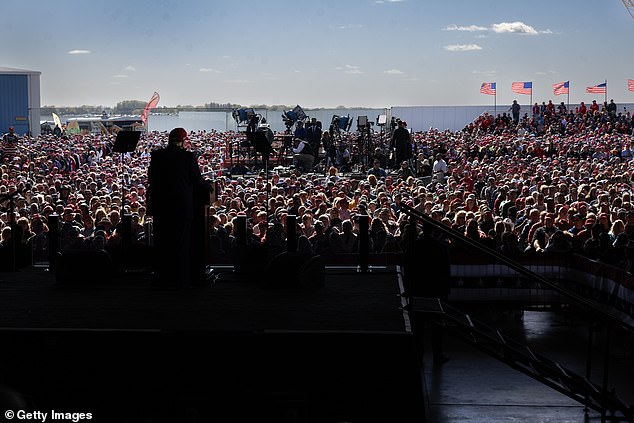 The former president (pictured in front of the Wisconsin rally crowd) has historically been sensitive to the size of his rally crowd and often brags about how many people come out to hear him speak