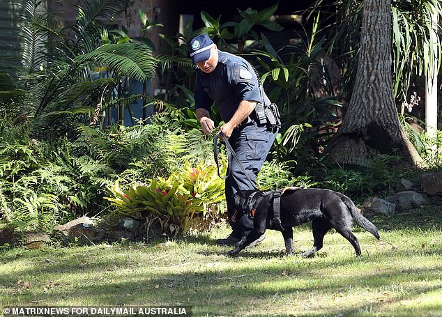 Police are seen overseeing bushland clearance in the nearby town of Kendall during a 2021 search for William