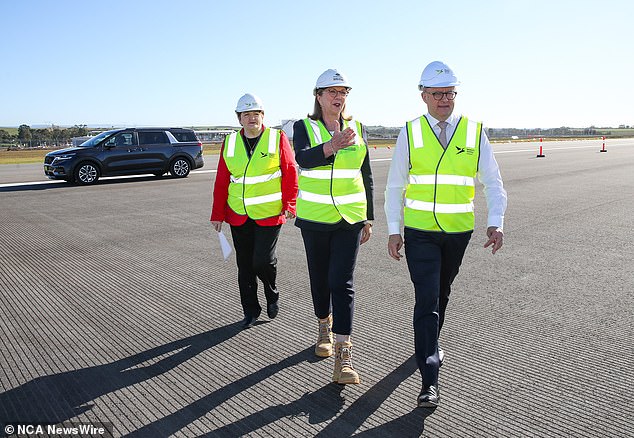 Transport Minister Catherine King (pictured with Anthony Albanese) says she has not ruled out the government buying a stake in Rex Airlines after the airline went bankrupt in August.