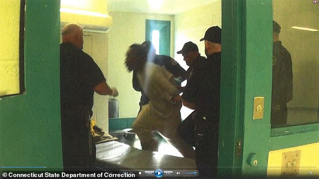 Corrections officers forced Jones onto his bed