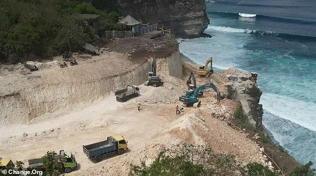 Excavators build service wall and seawall at the base of the Uluwatu cliffs, alarming conservationists