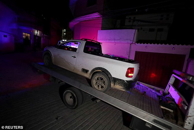 Authorities in Chilpancingo, a city in the southwestern Mexican state of Guerrero, locate the pickup truck where the body of slain mayor Alejandro Arcos was found murdered. The 43-year-old's severed head was found on top of the vehicle