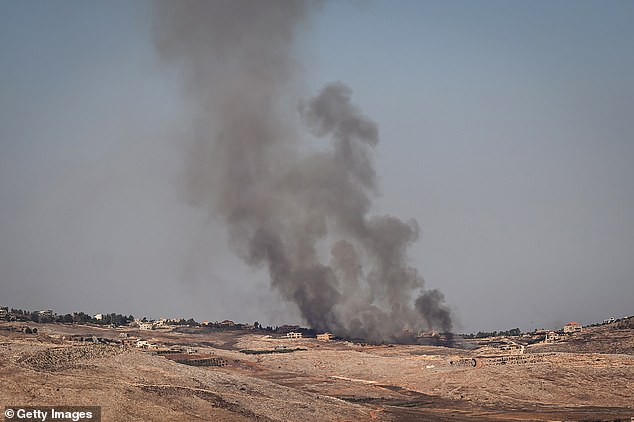 Smoke rises from a village across the border from Lebanon after an Israeli Air Force attack on October 4, 2024 in Rihaniya, Israel