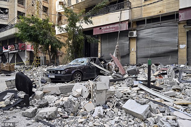 A damaged car among the rubble of a building after an Israeli airstrike on the Dahieh district in Beirut, Lebanon, October 8, 2024