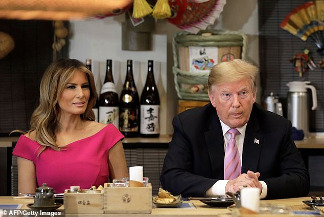 Donald and Melania Trump attend a dinner with Japanese Prime Minister Shinzo Abe and his wife Akie Abe at Inakaya restaurant in Tokyo's Roppongi district during their visit in May 2019