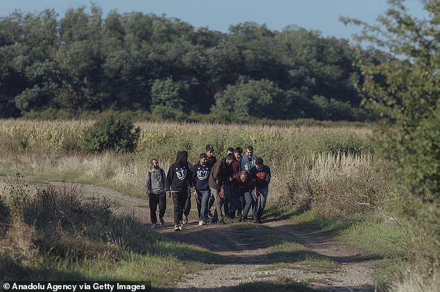 Migrants cross the Slovak-Hungarian border near Vyskovce Nad Iplom, Slovakia on September 6, 2023