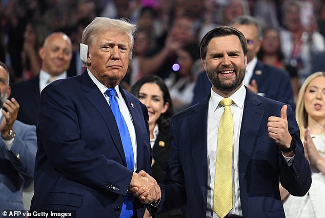 Ohio Senator and 2024 Republican vice presidential nominee J.D. Vance (R) gives a thumbs up as he shakes hands with ex-president and 2024 Republican presidential nominee Donald Trump during the second day of the 2024 Republican National Convention at Fiserv Forum in Milwaukee, Wisconsin, July 16, 2024.