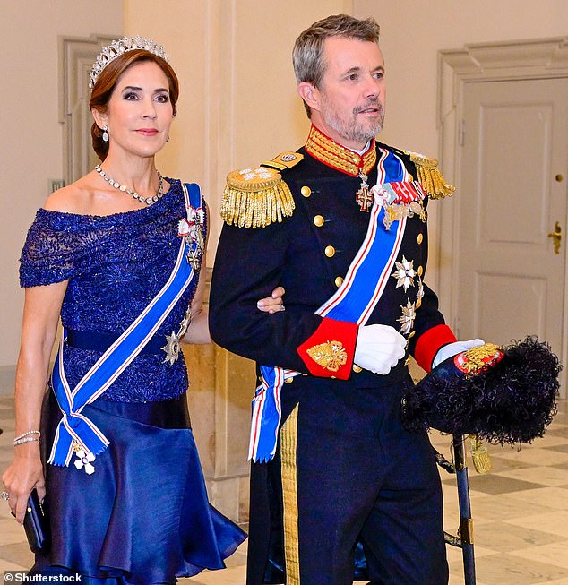 For the banquet, which was held at Christiansborg Palace in the national capital, the mother of four (pictured, left) opted for a long dress with a lace top and a tiered skirt.