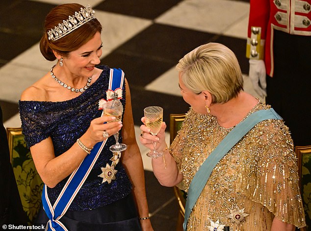 'HISTORICAL TIES AND CLOSE RELATIONSHIP': The state visit was held to strengthen and promote ties between the two countries, and Queen Mary (pictured, left) and Halla Tomasdottir (pictured, right) appeared friendly as they smiled at each other during a toast