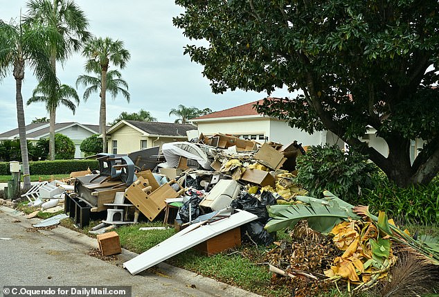 Damaged homes and debris strewn street of Tampa, Florida's Dana Shores neighborhood