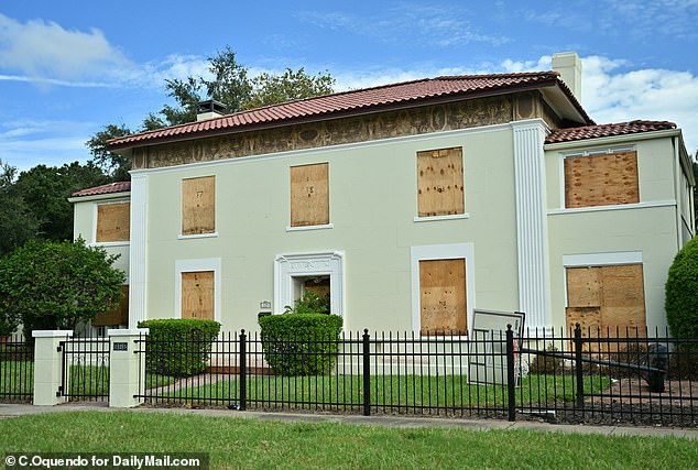 A boarded up and damaged home on Davis Island in Tampa, Florida, after Hurricane Helene