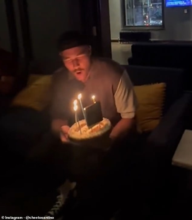 Santino also captured the moment he brought Kelce a birthday cake that night