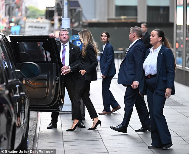 Former First Lady Melania Trump surrounded by Secret Service agents as she leaves Fox News on October 8 in New York City