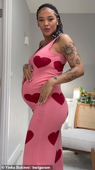 She donned a midi dress with pink and red hearts