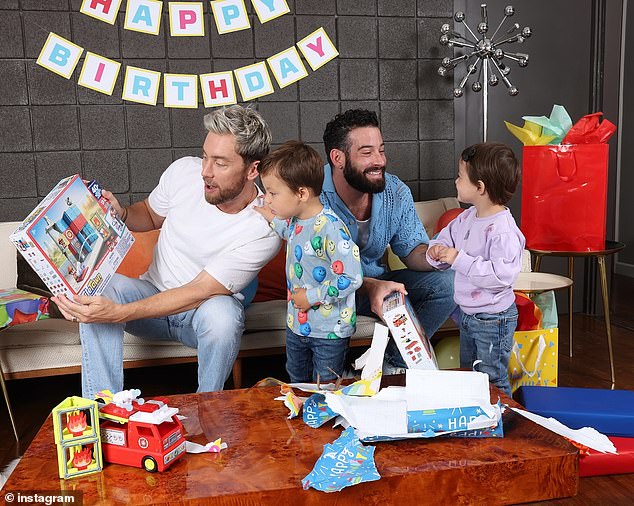 Later, the proud dads opened birthday presents with their adorable children