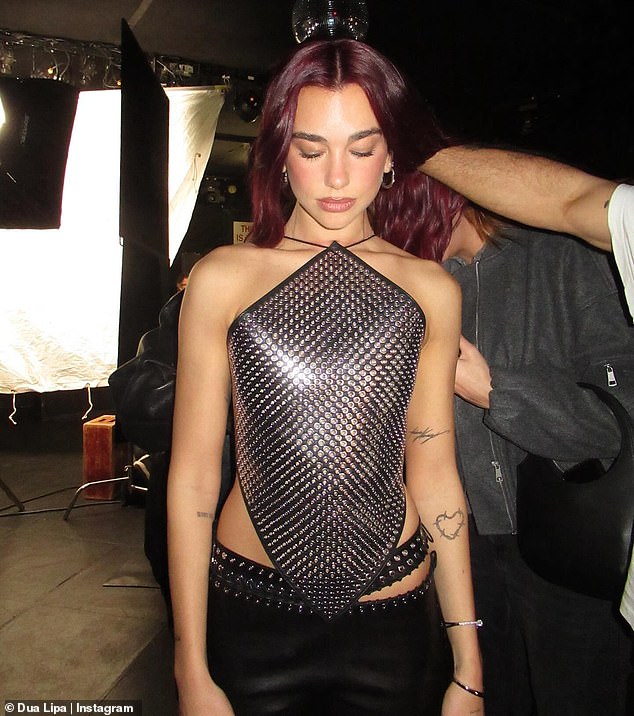 One photo showed Dua getting her hair and makeup touched up by her glam team. It gave fans a glimpse into the star's interview setup, which included an array of lighting softboxes and a black leather bar stool