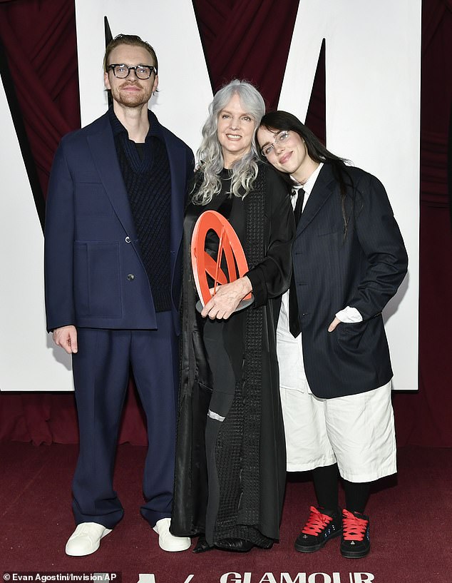 The actress, 65, arrived at the event carrying both of her Grammy-winning musician children and walked the red carpet with them at the Times Square EDITION hotel in New York City