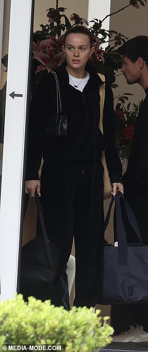 The couple both dressed in black for their private jet flight, which took the very modern family from Queenstown to Sydney