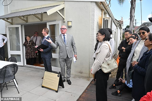 The family home, or a person's principal residence, has been exempt from capital gains tax since its introduction in September 1985 (photo, an auction in Sydney)