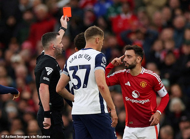 Fernandes was shown a red card by referee Chris Kavanagh (left), who refused to change his decision