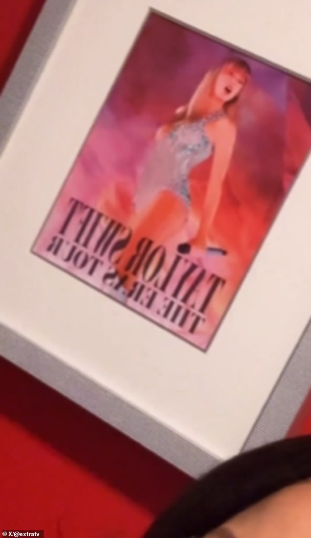 Unbeknownst to Swift, a photo of herself from her record-breaking Eras Tour hung on the wall behind them as they spoke. Swift performed at Arrowhead Stadium in July 2023