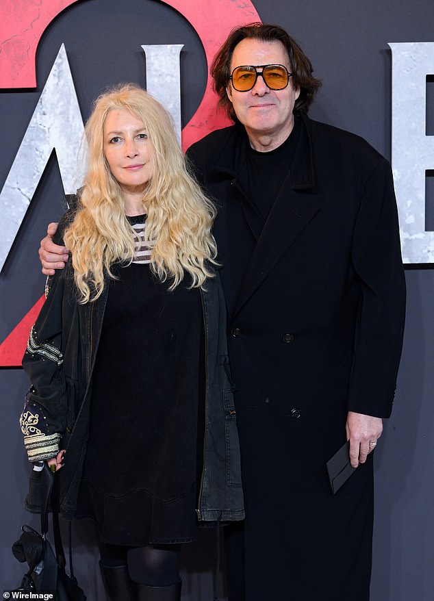 The screenwriter and producer, 54, looked sensational as the pair matched in all-black outfits at the event in London.