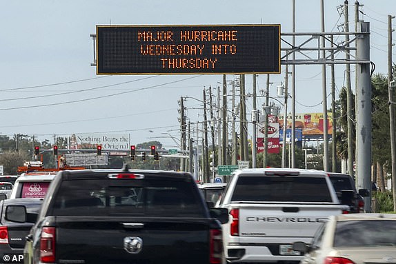 Highway signage announces the impending arrival of Hurricane Milton and evacuation zones on Tuesday, October 8, 2024 in Port Richey, Florida. (AP Photo/Mike Carlson)