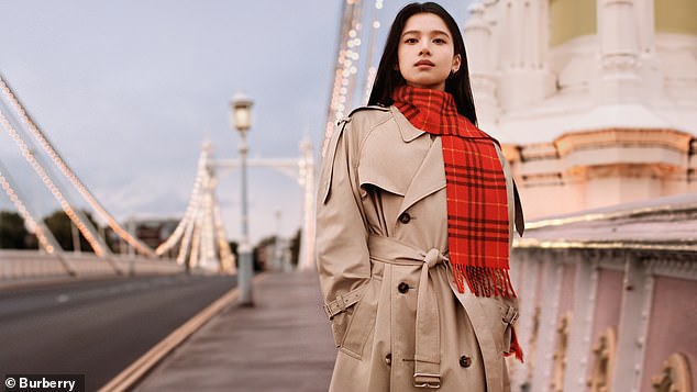 Actress Zhang Jingyi looked sensational in a beige trench coat which she wore with a bright red plaid scarf