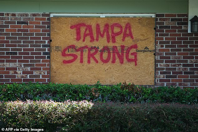 A message on boards put up about windows in Tampa ahead of Hurricane Milton