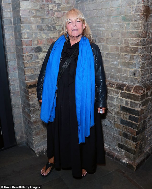 Linda Robson wore a black dress, a black leather jacket and a bright blue scarf