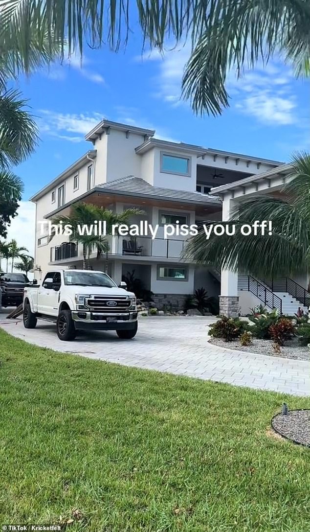 The woman then walked to her enormous home, which had a large stone driveway filled with pickup trucks and construction workers helping her family prepare for the storm.