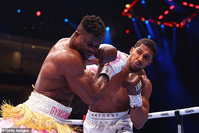 Joshua's (right) last win came in March against Ngannou (left), where he defeated the MMA star with a second-round knockout win