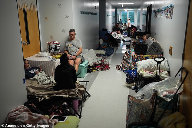 (Above) Hundreds take shelter at Virgil Mills Elementary School ahead of Hurricane Milton, in Palmetto, Florida