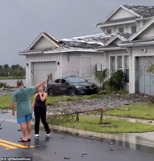 Lawns were left covered in debris and nearby cars were heavily damaged