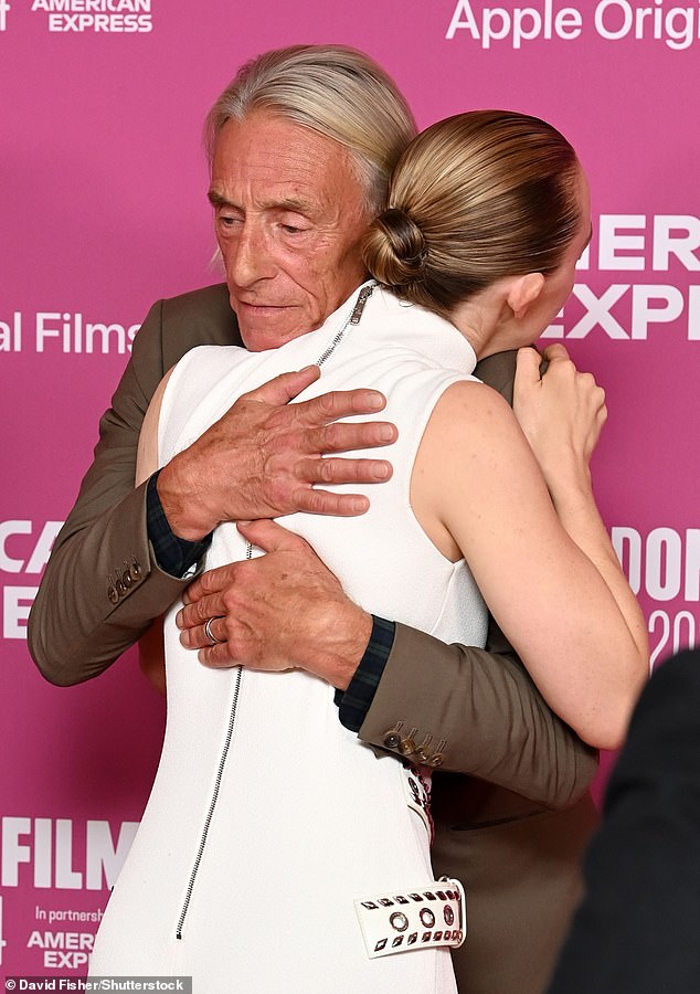 The actress was in good spirits as she hugged co-star Paul Weller