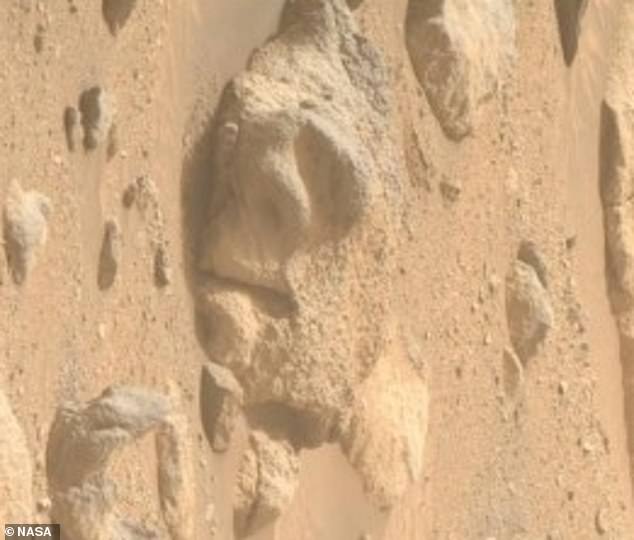 The rock has a tired, listless expression and combined with its horizontal position, it looks like this Martian face has just given up