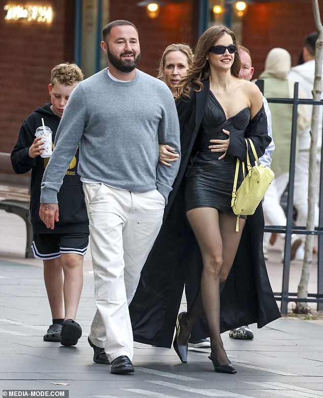 Barbara opted for opaque tights to match the look and wore statement sunglasses. She later looked in good spirits as she was joined by her friend and hairstylist Owen Gould (pictured left)